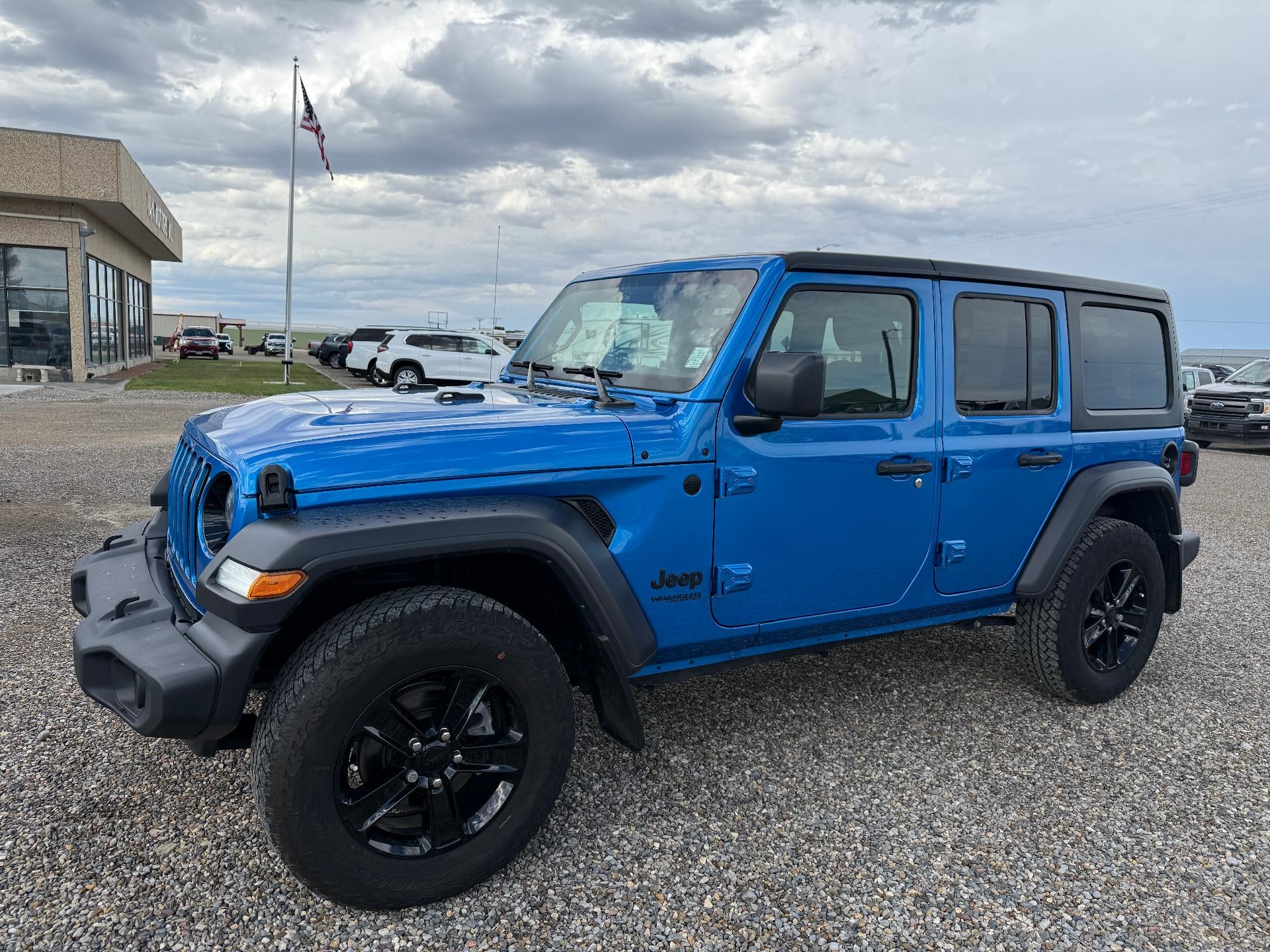 2022 Jeep Wrangler Unlimited Sport in Blue — front three-quarter view