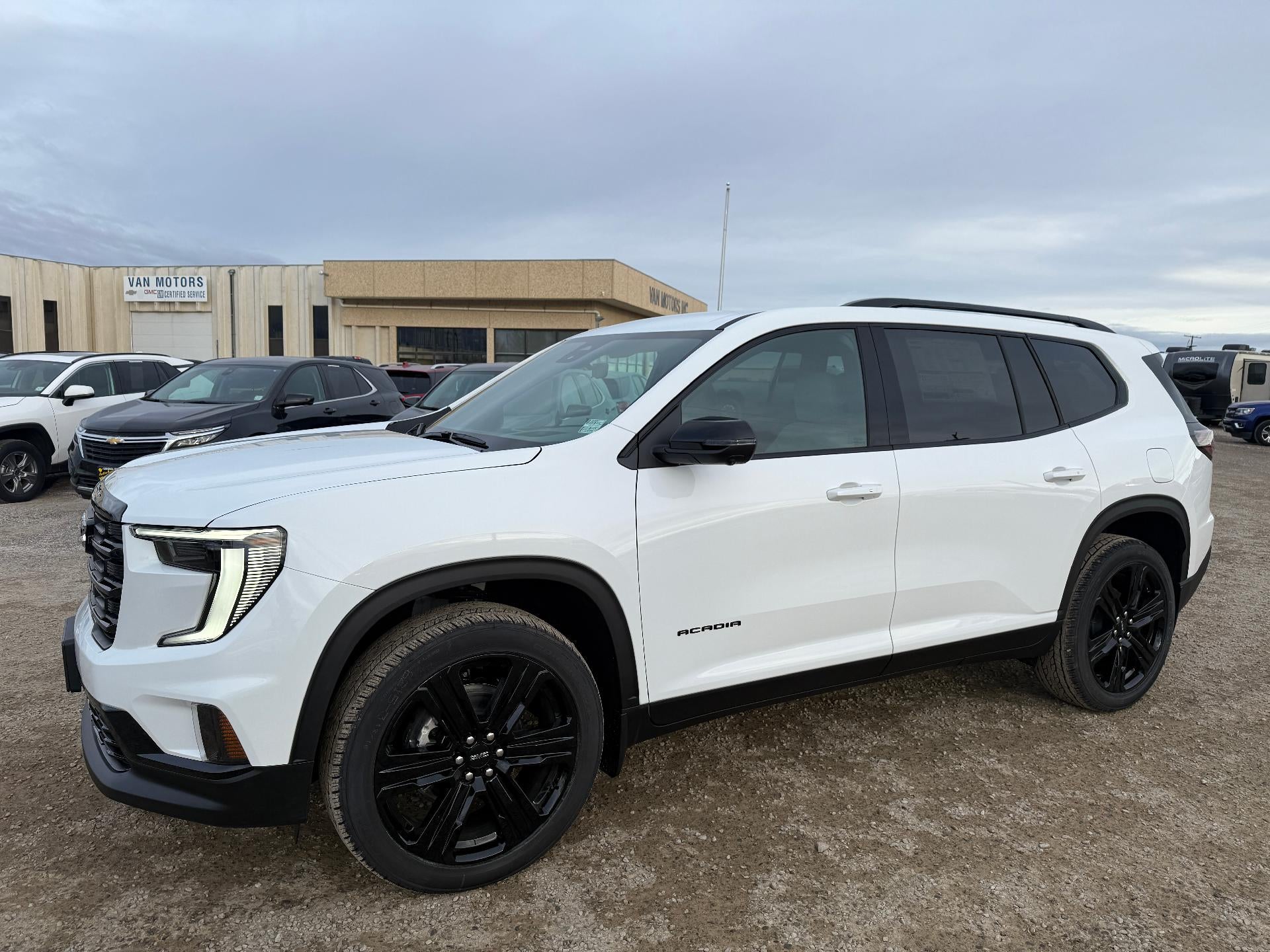 2026 GMC Acadia Elevation in Summit White — front three-quarter view