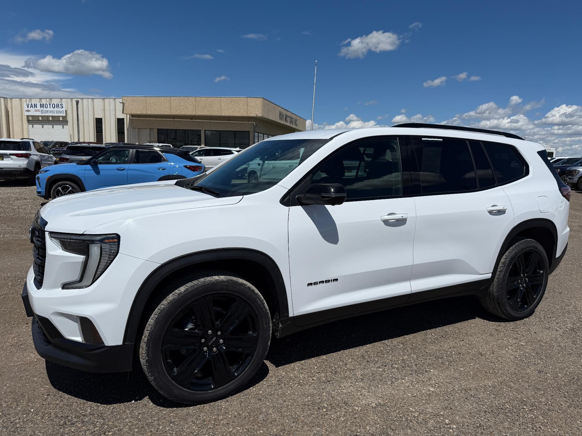 2025 GMC Acadia Elevation in Summit White — front three-quarter view