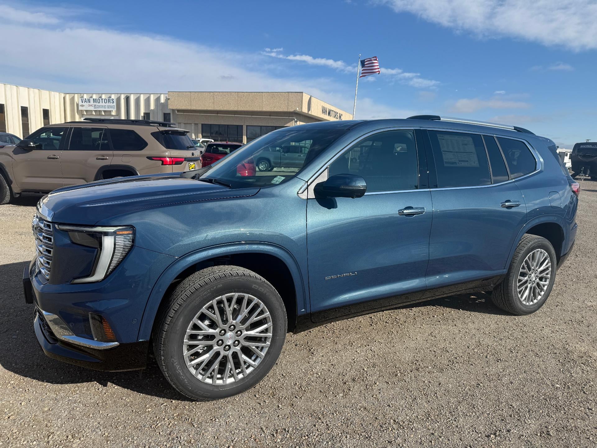 2026 GMC Acadia Denali in Downpour Metallic — front three-quarter view