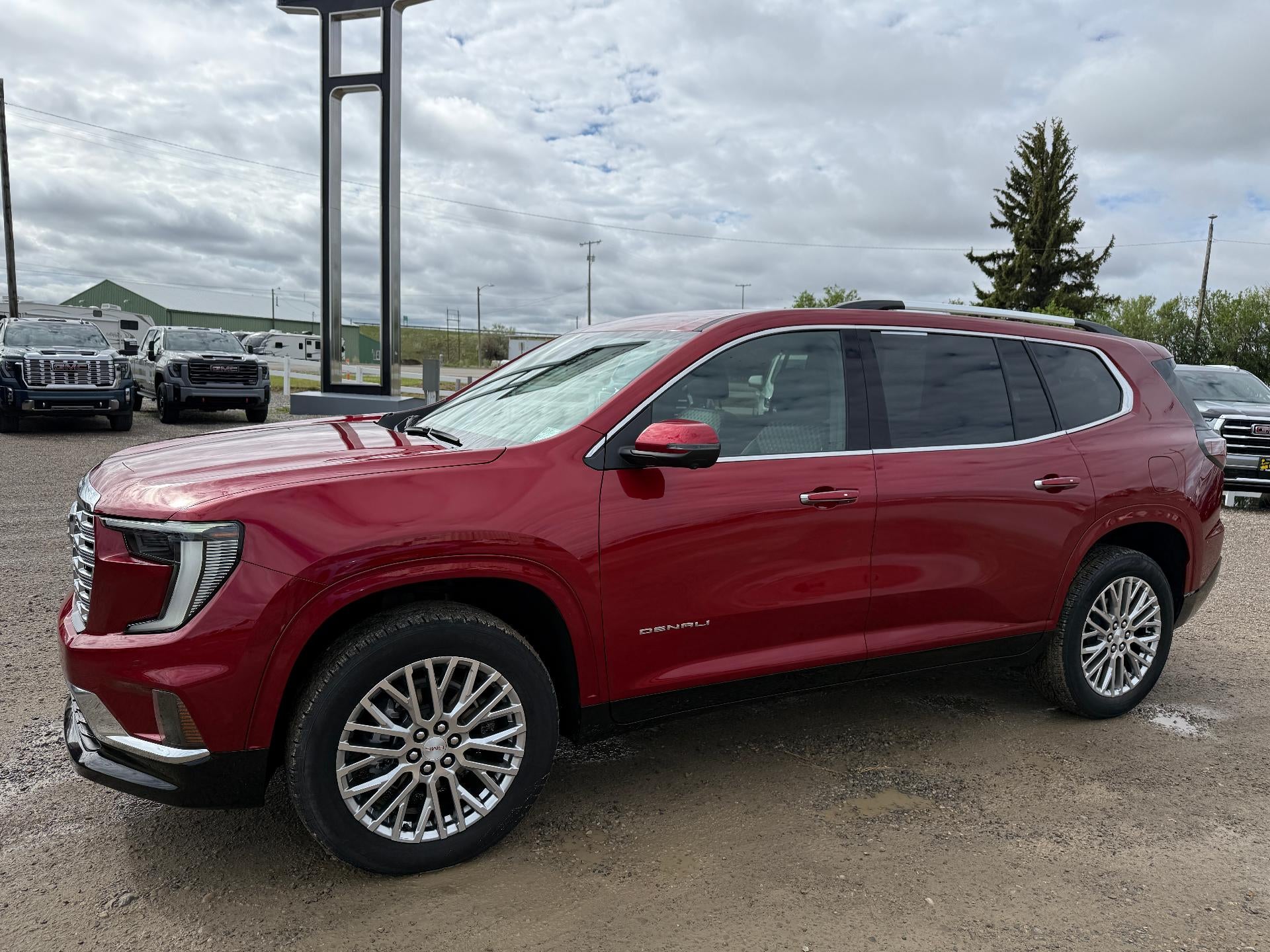 2025 GMC Acadia Denali in Volcanic Red Tintcoat — front three-quarter view