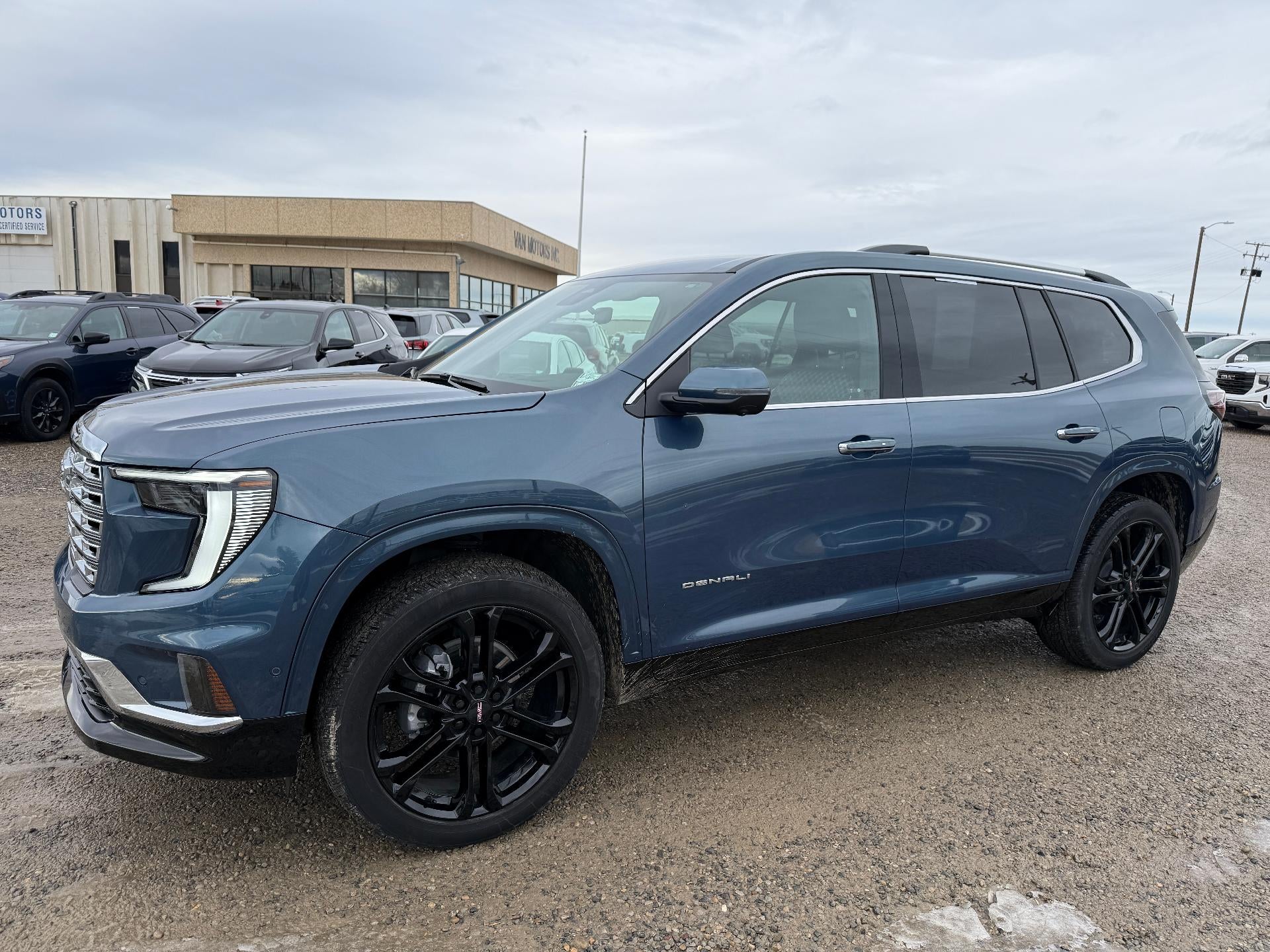 2025 GMC Acadia Denali in Downpour Metallic — front three-quarter view