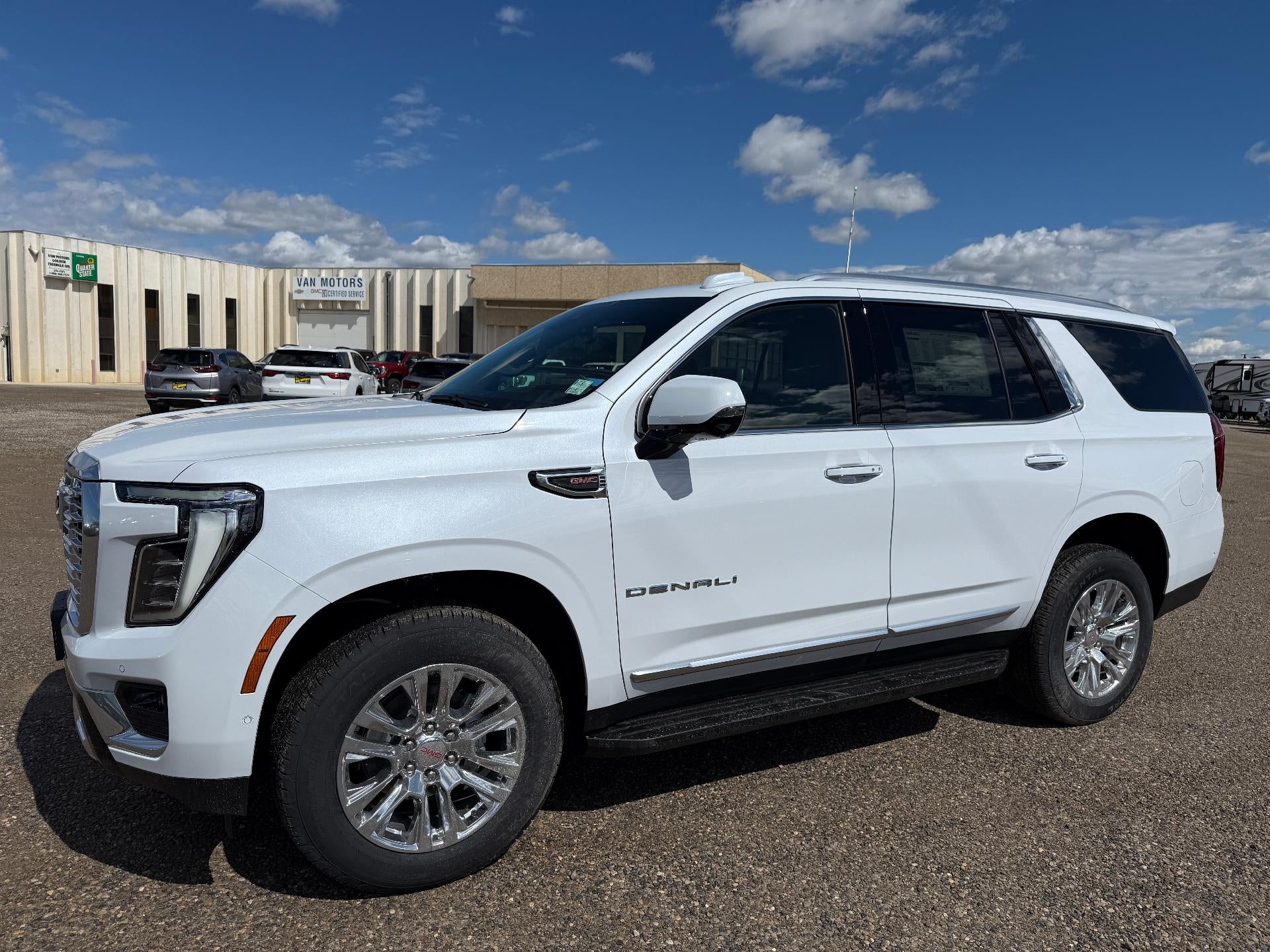 2026 GMC Yukon Denali in Glacier White Tricoat — front three-quarter view