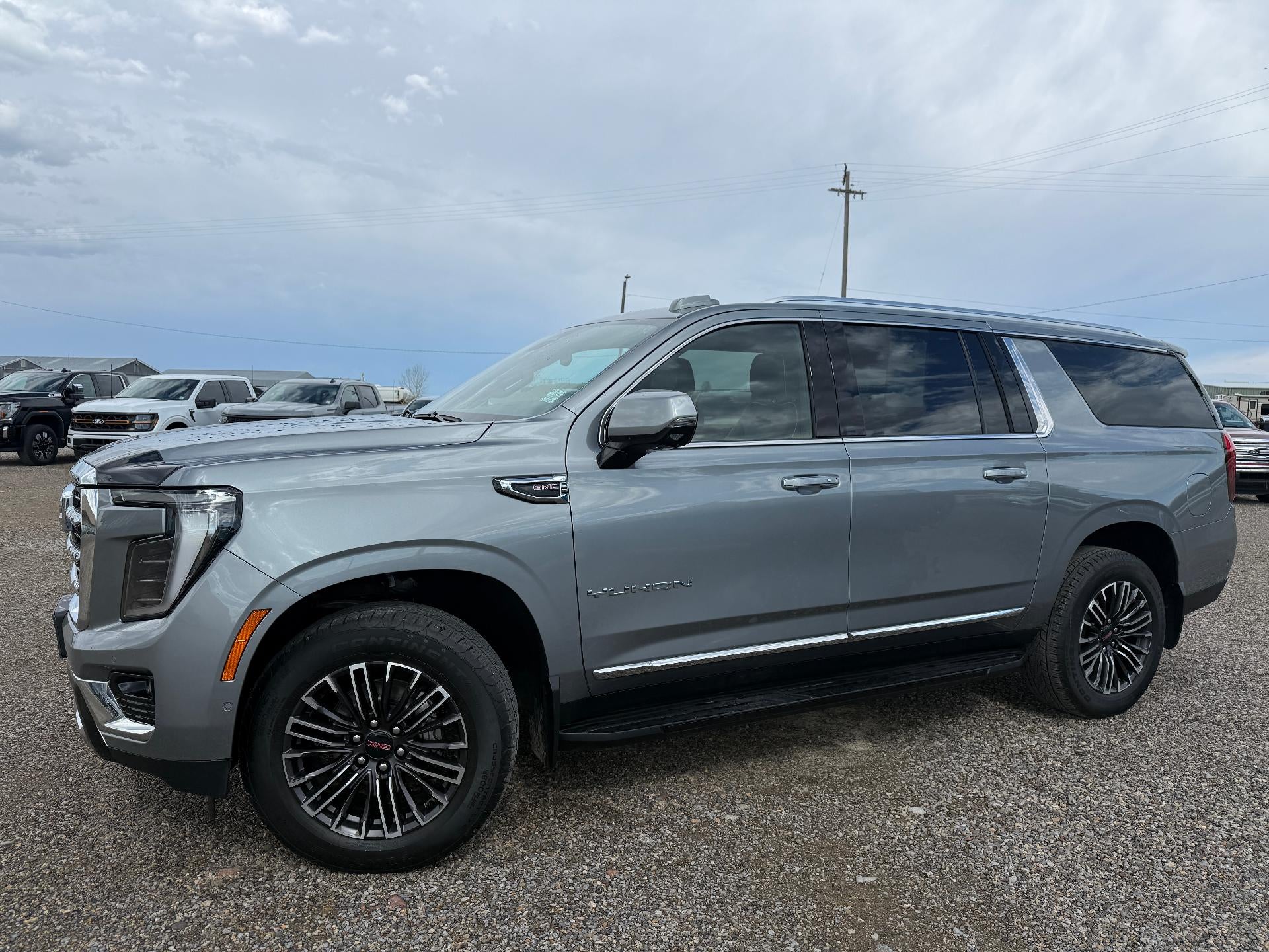 2025 GMC Yukon XL Elevation in Sterling Metallic — front three-quarter view
