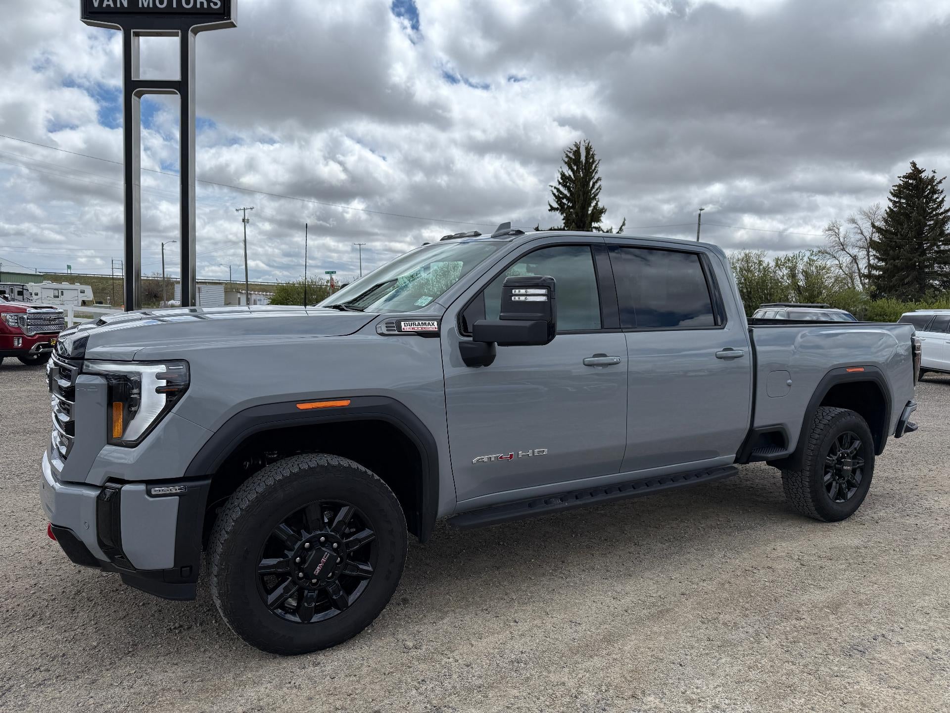 2025 GMC Sierra 3500 HD AT4 in Thunderstorm Gray — front three-quarter view