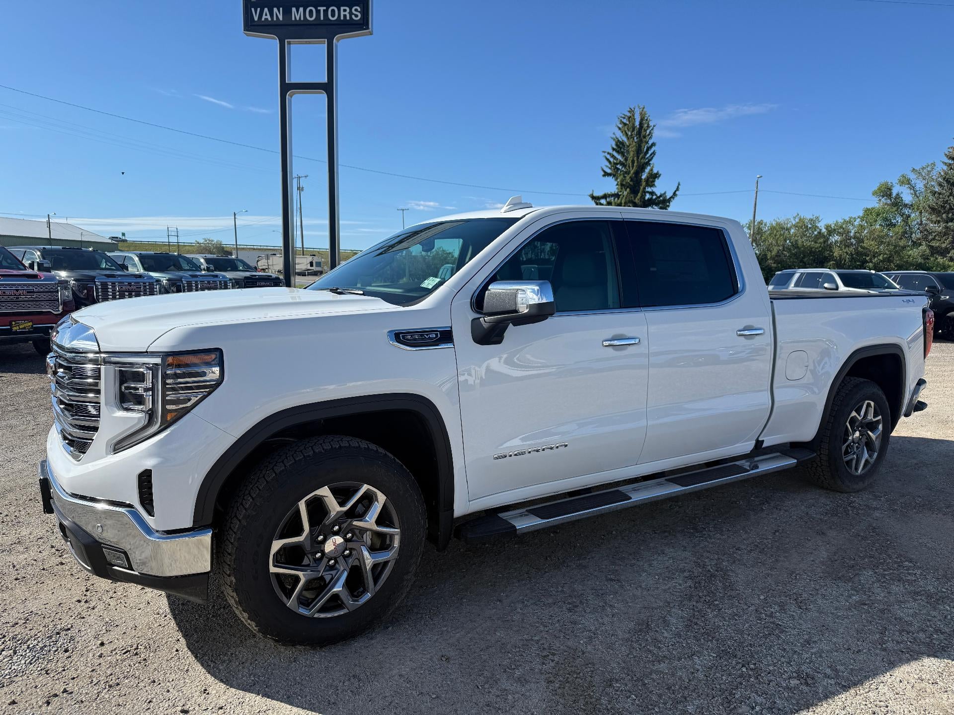 2026 GMC Sierra 1500 SLT in Summit White — front three-quarter view