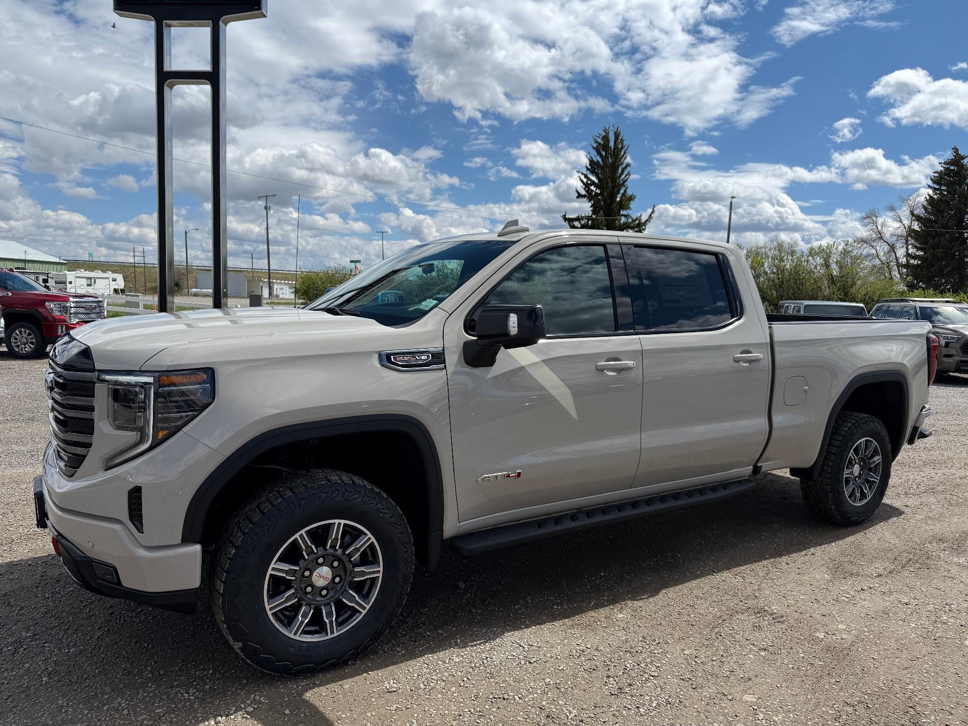 2026 GMC Sierra 1500 AT4 in Coastal Dune — front three-quarter view