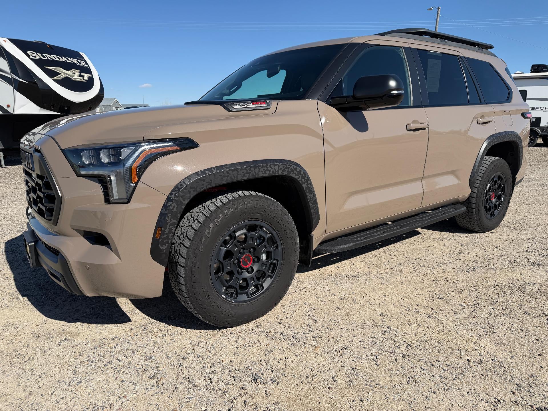 2025 Toyota Sequoia SR5 in Brown — front three-quarter view